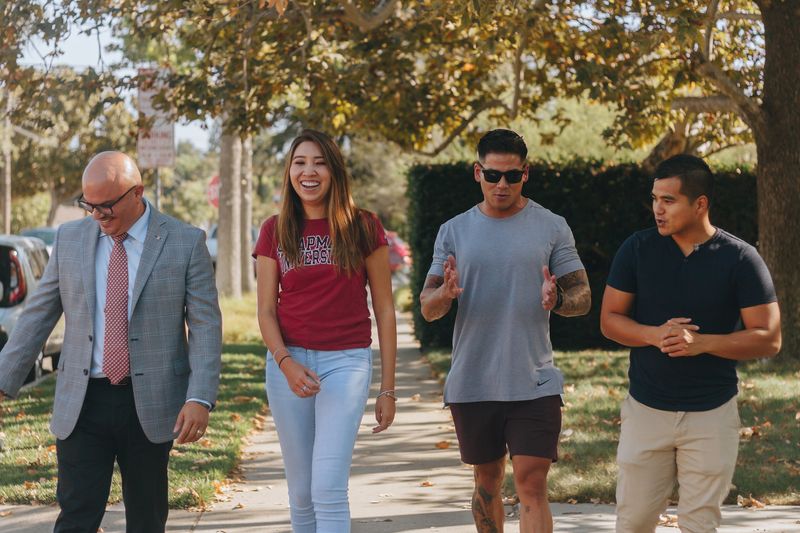 students walking and talkin on the Chapman campus